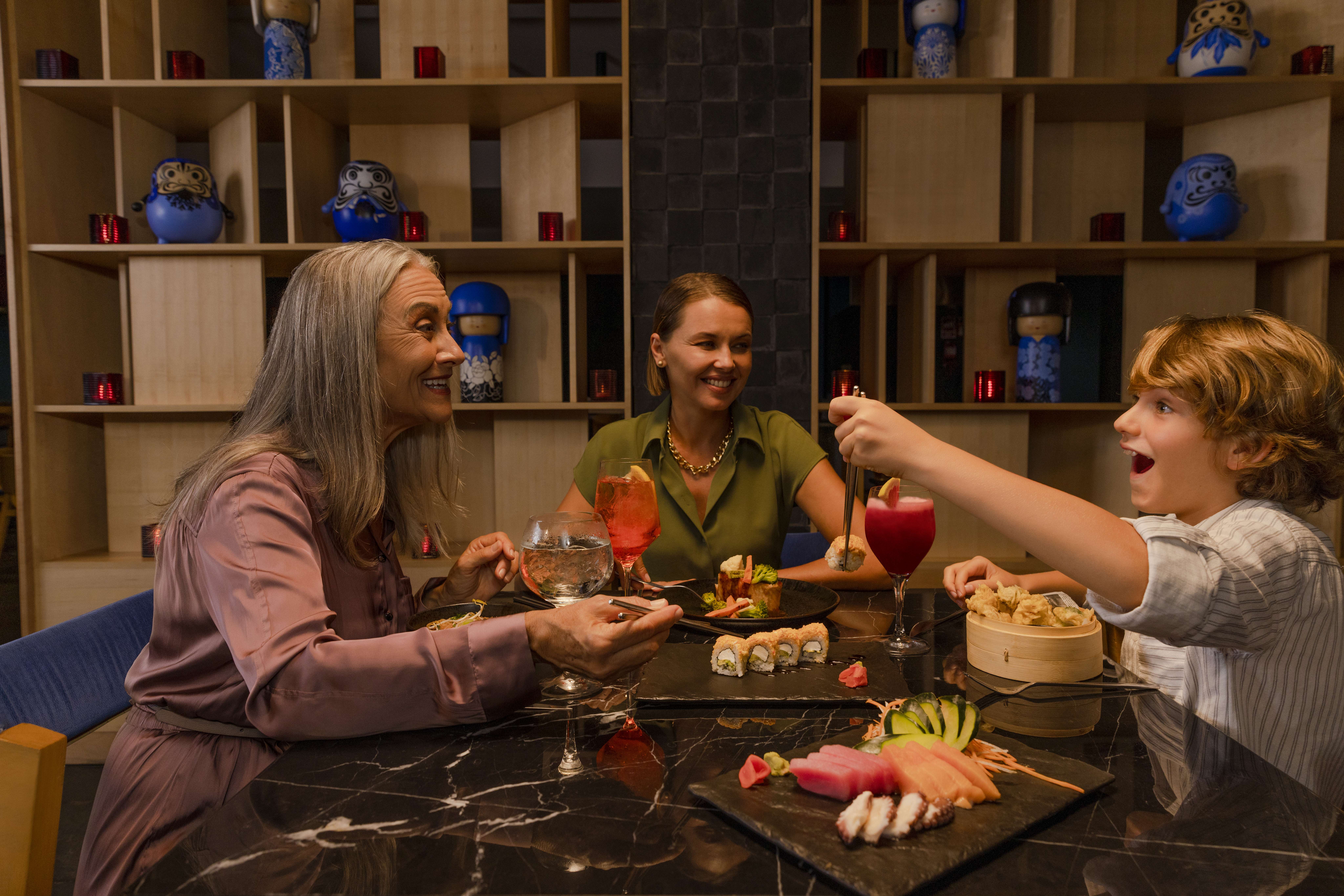Smiling family sharing a delicious dinner together.