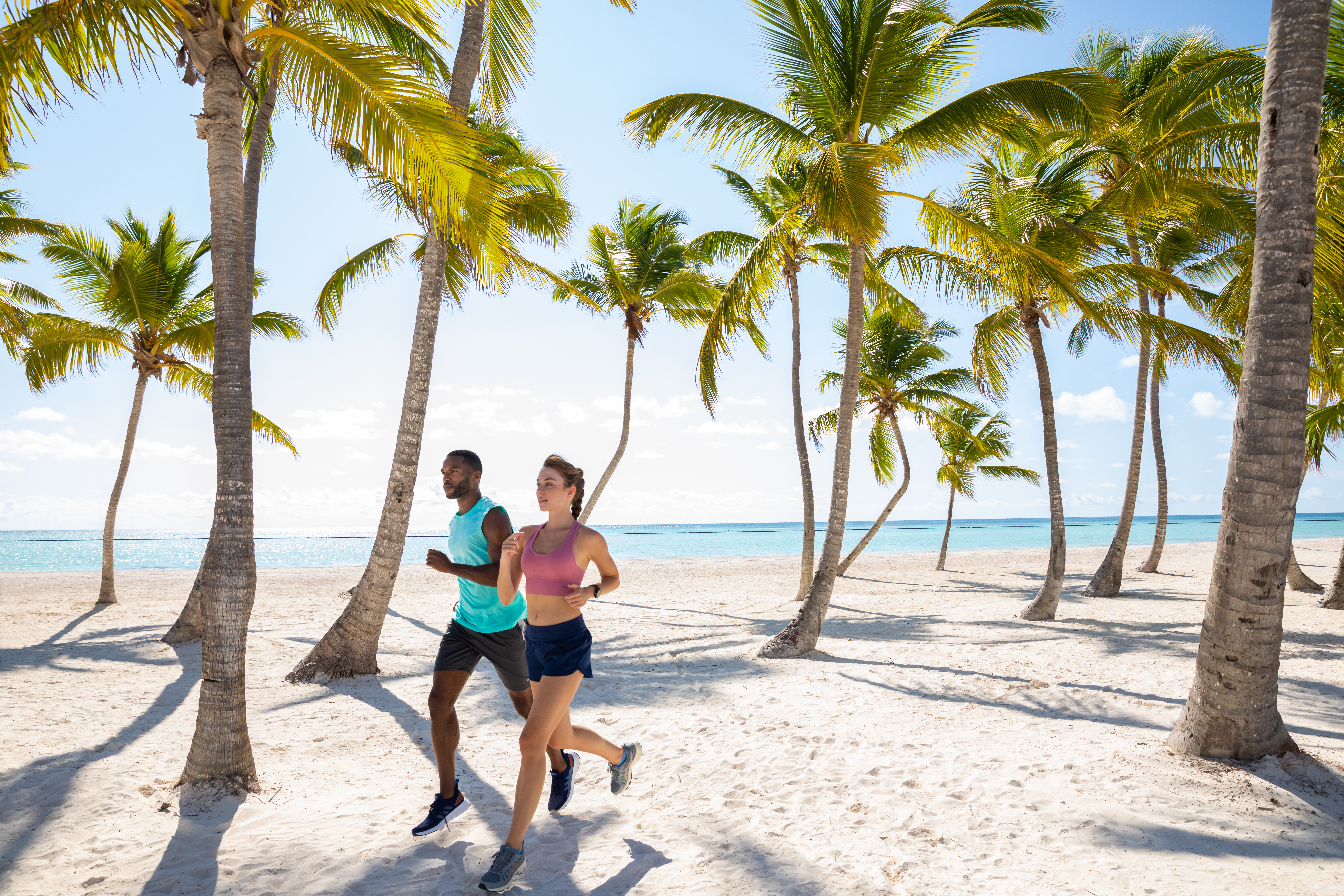 Couple running on the beach.